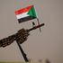 Sudanese national flag is attached to a machine gun of Paramilitary Rapid Support Forces (RSF) soldiers