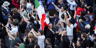 Faithful react to the white smoke indicating that a new pope has been elected