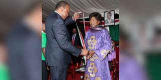 Uhuru Kenyatta and Phoebe Asiyo