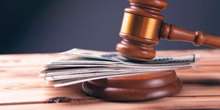 Gavel and money in court.