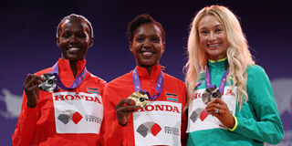 Faith Kipyegon and Dorcus Ewoi