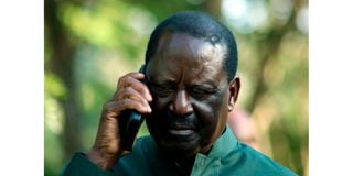 Azimio leader Raila Odinga in a phone call during Azimio Parliamentary Group Presser at Kalonzo Command Centre