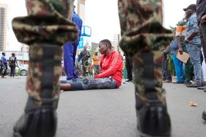 Raila Odinga's supporters mourn him outside Parliament