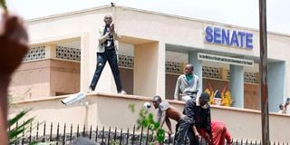 Raila Odinga's supporters mourn him outside Parliament