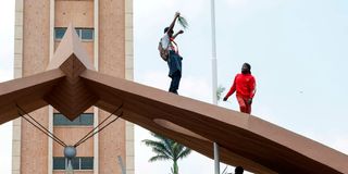 Raila Odinga's supporters mourn him outside Parliament