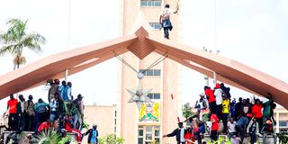 Raila Odinga's supporters mourn him outside Parliament