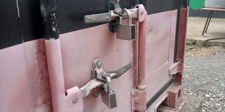 The special digital padlock is seen on a Knec container