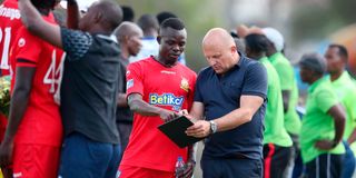 Kenya Police head coach Zdravko Logarusic (right) gives instructions to midfielder David Okoth 