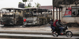 wreckage of buses burnt protests tanzania