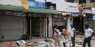 wreckage of buses burnt protests tanzania