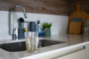 Dirty glass of water on a kitchen table