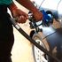 An attendant fuels a car at a Nyeri petrol station