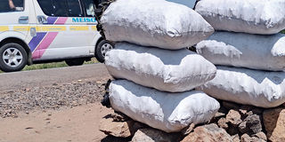 Charcoal laid out for sale on the Kenol–Sagana highway. Muthike
