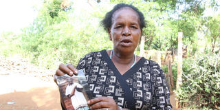 Charcoal laid out for sale on the Kenol–Sagana highway. Muthike