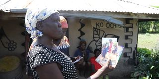 Mary Ochieng displays old photos of her daughter, Phedona Awuor