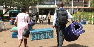 A Grade 10 student arrives at Nakuru High Senior School 