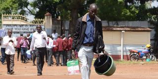 A Grade 10 student arrives at Nakuru High Senior School 