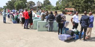 A Grade 10 student arrives at Nakuru High Senior School 