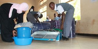 A Grade 10 student arrives at Nakuru High Senior School 