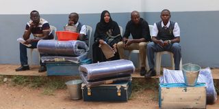 A Grade 10 student arrives at Nakuru High Senior School 