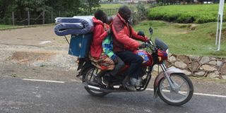 Parents, and guardians queue outside the School Outfitters 