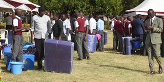 Parents, and guardians queue outside the School Outfitters 