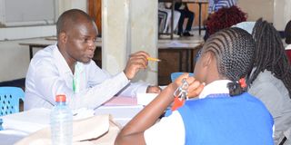 A Grade 10 student arrives at Nakuru High Senior School 