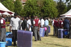 Parents, and guardians queue outside the School Outfitters 