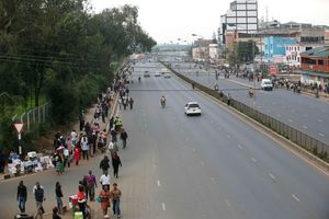 Nairobians walk along Thika Road as they head to the city centre
