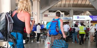 Travellers at the Moi International Airport in Mombasa