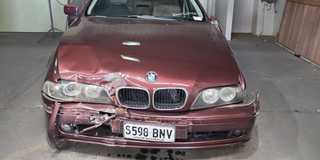 Caleb Leriano's red 2003 BMW