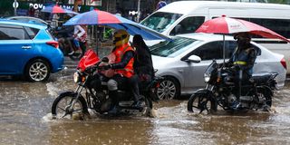 Motorists navigate a flooded section of Kenyatta Avenue in Nairobi heavy rains 