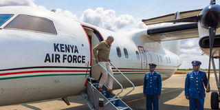 Kithure Kindiki alights from a Kenya Air Force plane