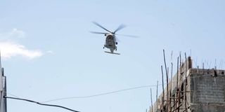 A helicopter flies over a part of Kisumu. 