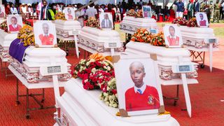 Caskets bearing the bodies of students who died in the Utumishi Girls Senior School fire at their requiem mass 