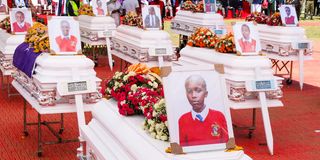 Caskets bearing the bodies of students who died in the Utumishi Girls Senior School fire at their requiem mass 
