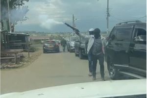 A screengrab of a video of armed men arriving at a polling station in Ol Kalou.