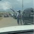 A screengrab of a video of armed men arriving at a polling station in Ol Kalou.