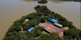 Homes surrounded by rising Lake Baringo waters. 