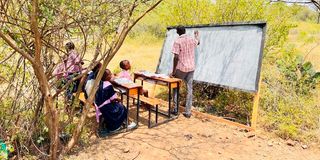 Homes surrounded by rising Lake Baringo waters. 