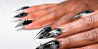 Woman's hand with black chrome nails