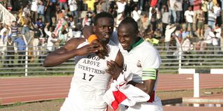 Macdonald Mariga celebrates his goal against Angola with Denis Oliench