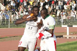 Macdonald Mariga celebrates his goal against Angola with Denis Oliench