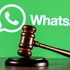 Gavel on table against background of Whatsapp 